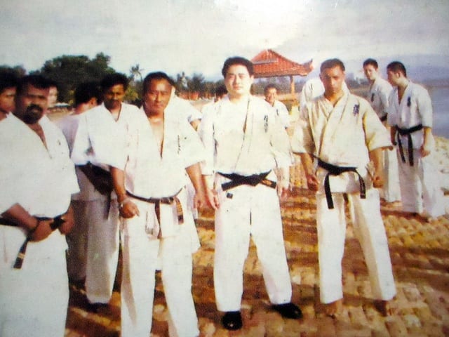 A group of Association members wearing garlands.