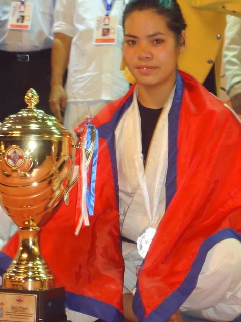A podium ceremony with the Nepali flag at the 13th Asian Open Kyokushin Karate Tournament.